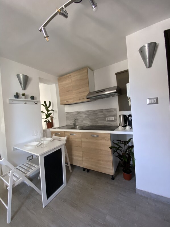 Fridge, coffee/tea maker, electric kettle, cookware/dishes/utensils