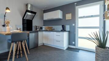 Fridge, microwave, stovetop, coffee/tea maker