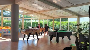 A spacious indoor area with a pool table, a billiards table, and a pool table. - Mobile Home "Le Marie Elodie 85" with 2 Shared Pools, Private Terrace & Wi-Fi (Angles)