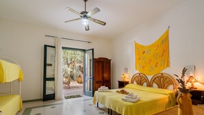 A hotel room with two beds, a ceiling fan, a large window, and a view of the outdoors. - Holiday Apartment "Domus Mea Salento Arazzo Giallo" with Shared Pool, Shared Terrace & Wi-Fi (Ugento)