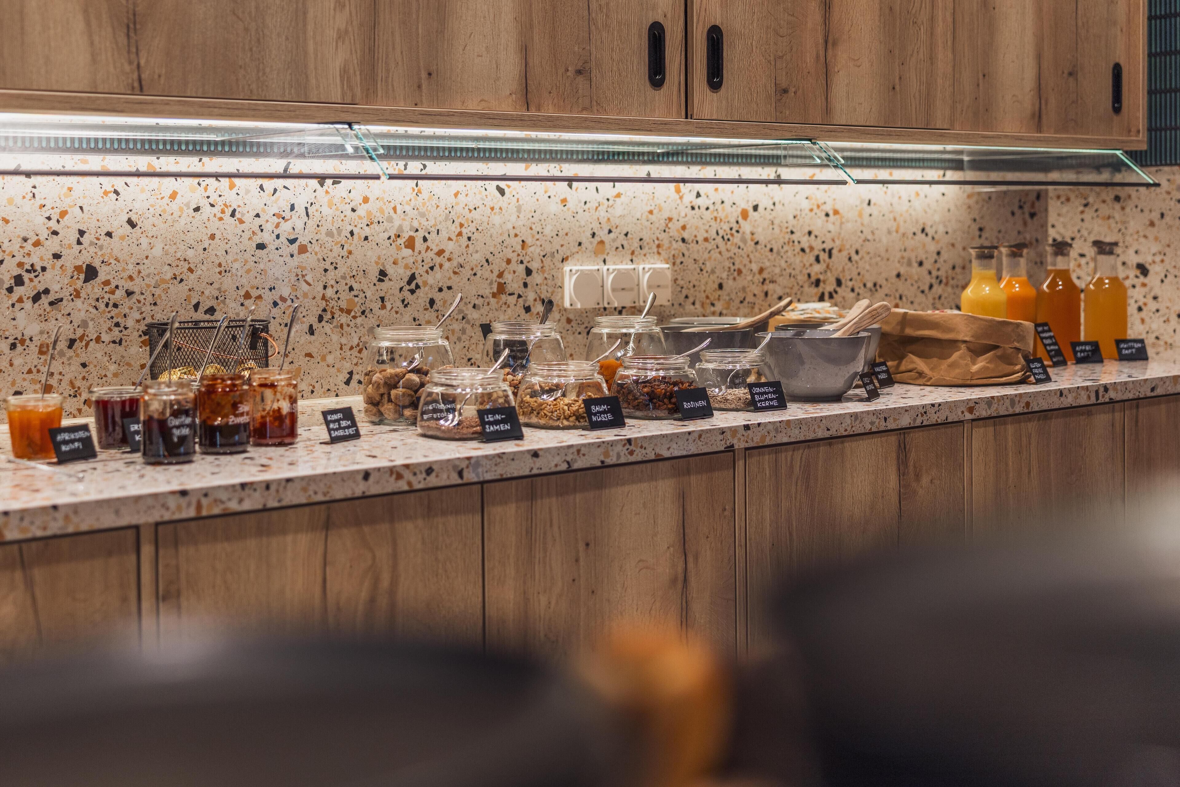A breakfast bar with various food items and beverages.