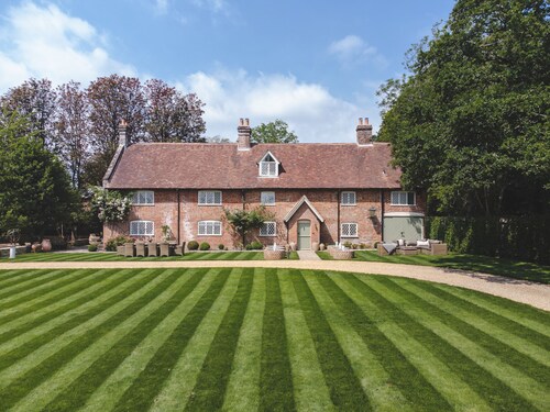 Luxury home in the New Forest featuring a year-round heated swimming pool.