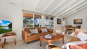 Relax in this inviting space with a comfortable sofa, coffee table, and seating area.