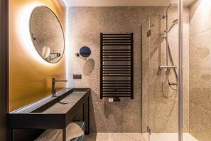 Shower, rainfall showerhead, hair dryer, towels
