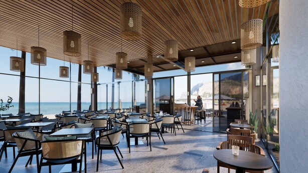 An outdoor dining area with wicker chairs and tables, large windows offering a view of the beach and mountains, and hanging wicker lamps. - Seabird Hotel Thien Cam (Thiên Cầm)