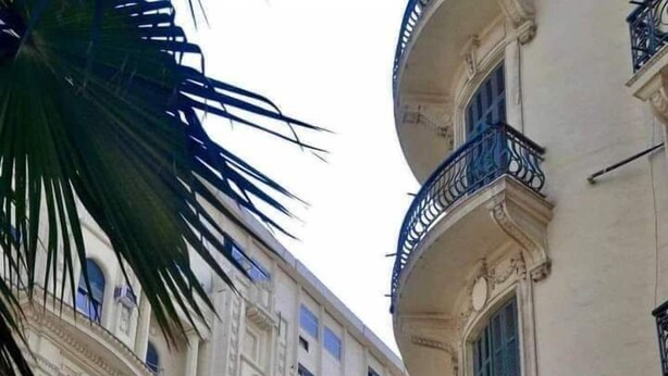 A multi-story building with ornate balconies and classical architectural details. - Cairo (Cairo)