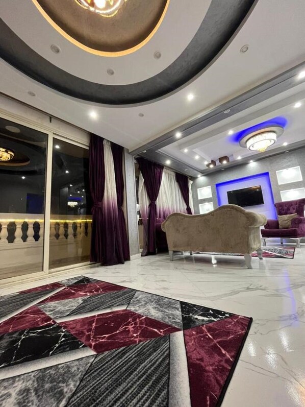 Deluxe Apartment | Living area | LCD TV - Heaven Pyramids View Apartment (Giza)