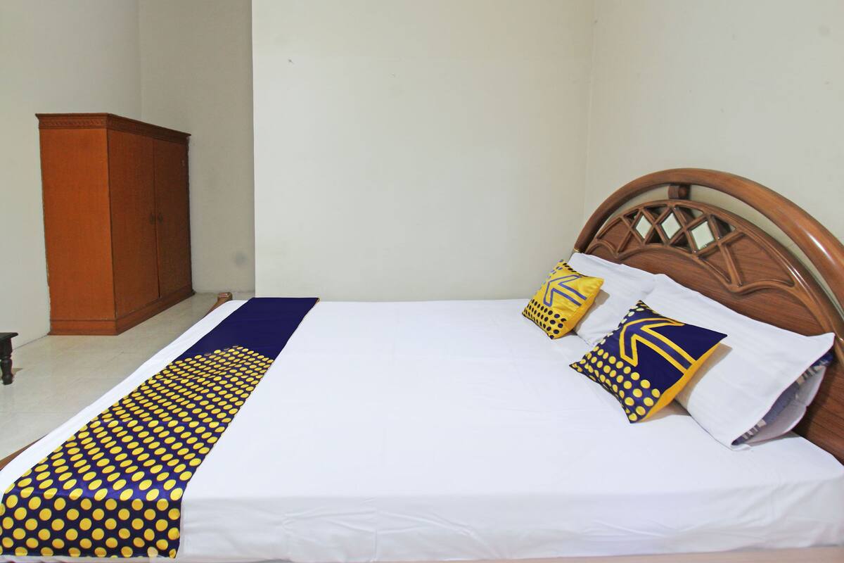 Laptop workspace, bed sheets