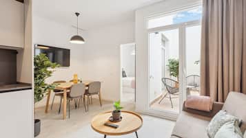 One-Bedroom Apartment with terrace | Living area | 50-inch flat-screen TV with satellite channels