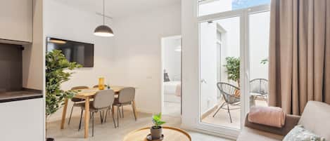 One-Bedroom Apartment with terrace | Living area | 50-inch flat-screen TV with satellite channels