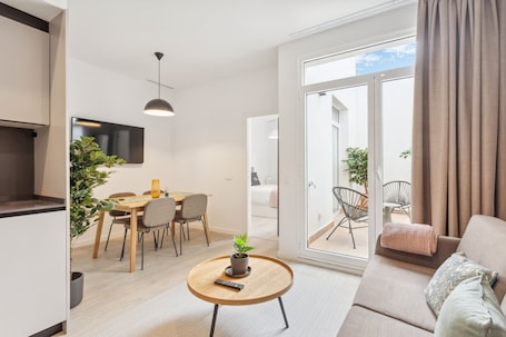 One-Bedroom Apartment with terrace | Living area | 50-inch flat-screen TV with satellite channels