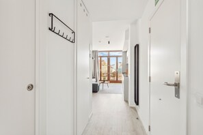 One-Bedroom Apartment with rooftop terrace | Living area | 50-inch flat-screen TV with satellite channels