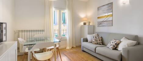 Deluxe Apartment | Living area | 40-inch flat-screen TV with digital channels