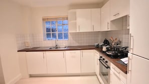 Apartment, 2 Queen Beds | Private kitchen | Fridge, microwave, oven, stovetop