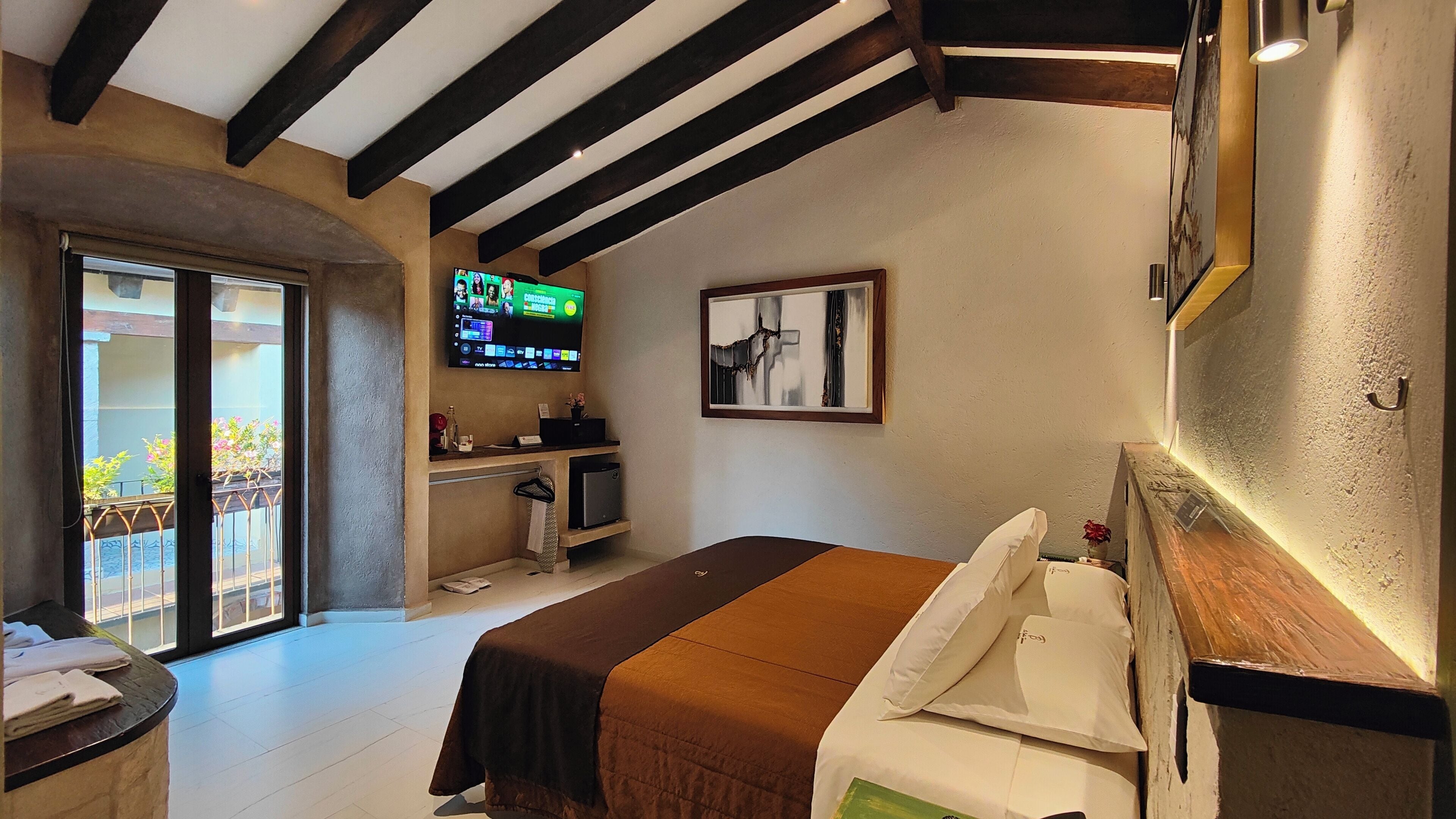 Deluxe Studio Suite, 1 King Bed, Balcony, Resort View | Individually decorated, individually furnished, blackout curtains