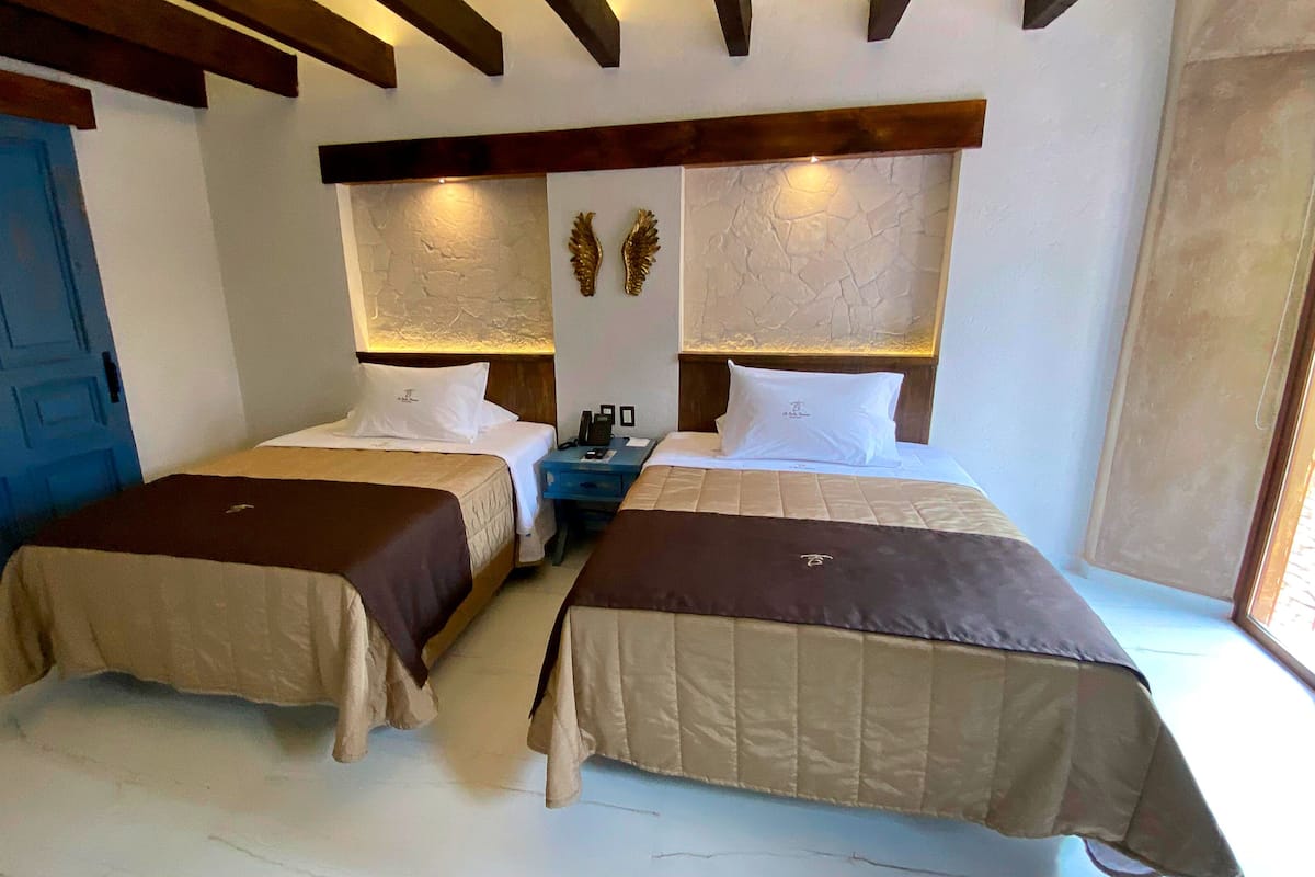 Design tweepersoonskamer, 2 queensize bedden, balkon, uitzicht op resort | 1 slaapkamer, individueel gedecoreerd, individueel gemeubileerd
