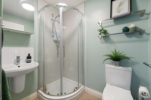 Shower, hair dryer, towels, soap