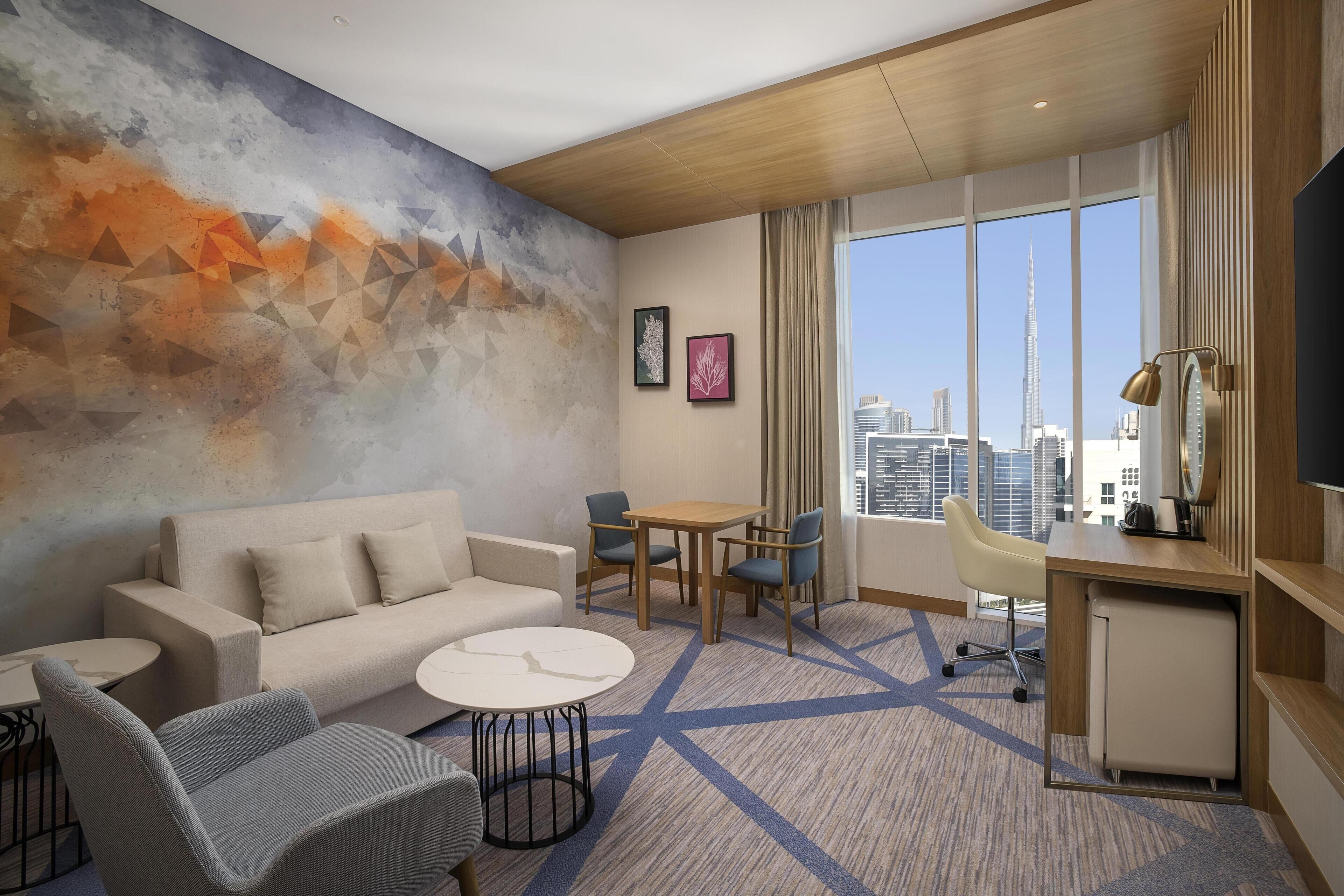 Suite, 1 Bedroom | Living area | 55-inch LED TV with cable channels