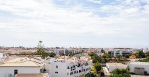 A residential area with a mix of modern and traditional architecture, including buildings with flat roofs and balconies. - #189 Montechoro Flat by Home Holidays (Albufeira)