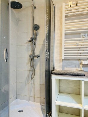 Shower, hair dryer, towels, soap