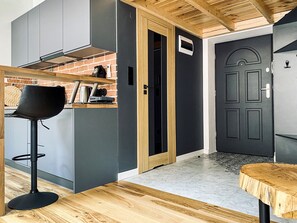 Fridge, stovetop, dishwasher, coffee/tea maker