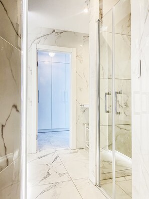 Shower, hair dryer, towels, soap