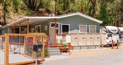 Retro RV with picturesque hills and lake access