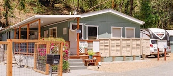 Retro RV with picturesque hills and lake access