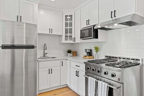 Fridge, microwave, stovetop, coffee/tea maker