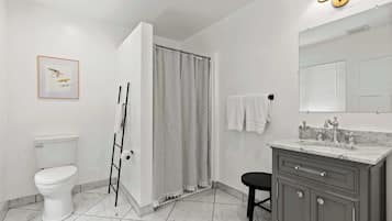 Shower, hair dryer, towels, shampoo