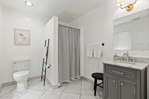 Shower, hair dryer, towels, shampoo