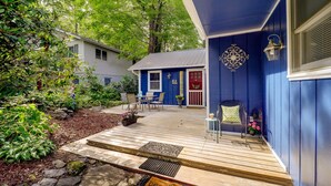 A wooden deck with outdoor furniture, a mailbox, and a small garden area. - 10 Mi to Sugar Mtn: ‘Bluebird Cottage’ in Newland (Newland)