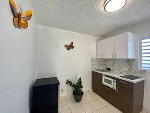 Fridge, microwave, stovetop, coffee/tea maker