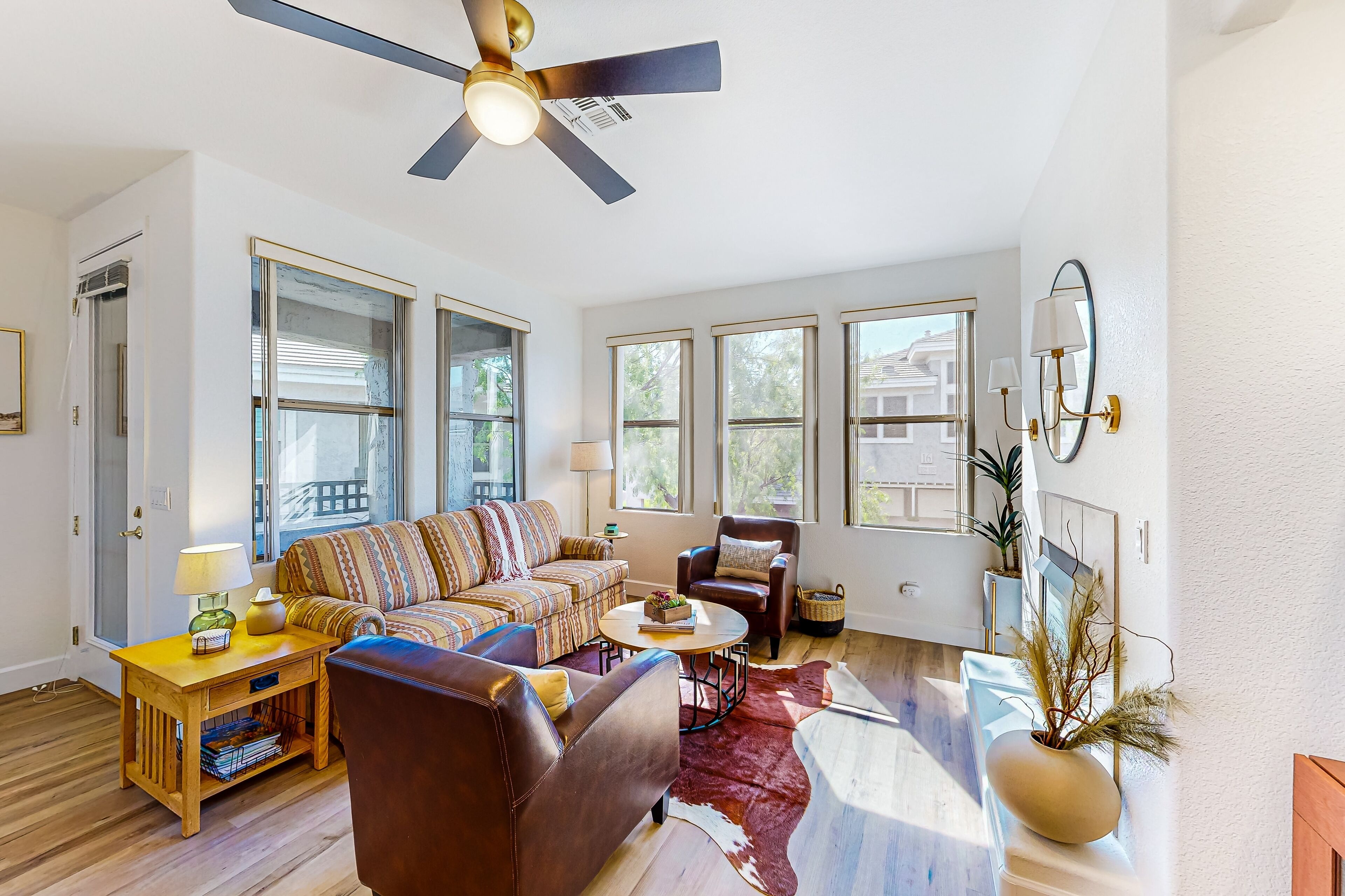 Gated community condo with pool, hot tub, gym, & private patio - near golf