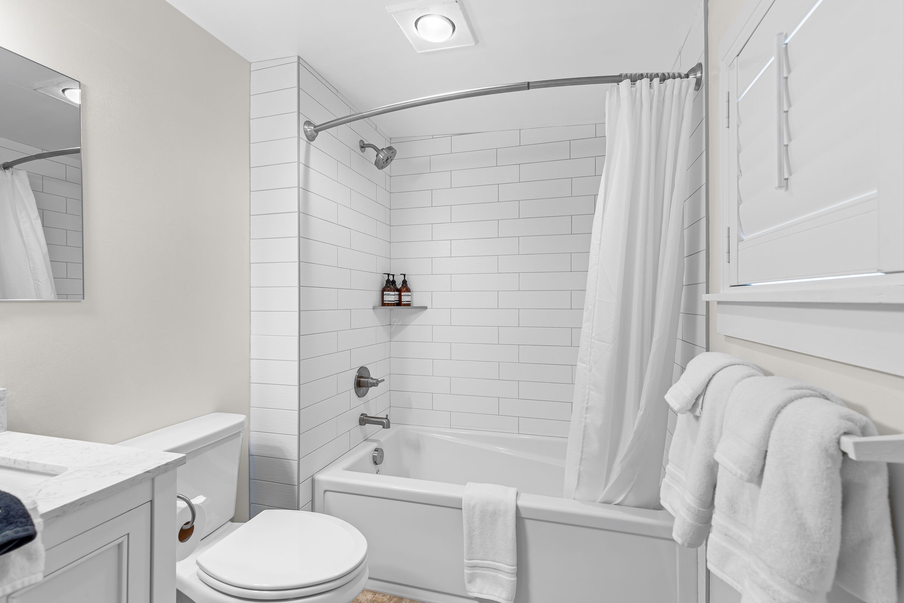 Shower, hair dryer, towels, shampoo