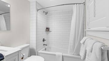 Shower, hair dryer, towels, shampoo