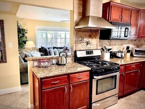 High chair, blender, cookware/dishes/utensils, spices