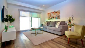 Two-Bedroom Suite with Balcony | Living area | 60-inch Smart TV with digital channels, Netflix, Hulu