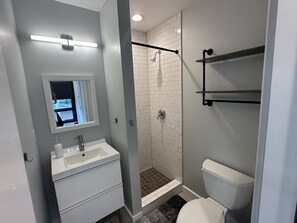 Shower, towels, shampoo, toilet paper