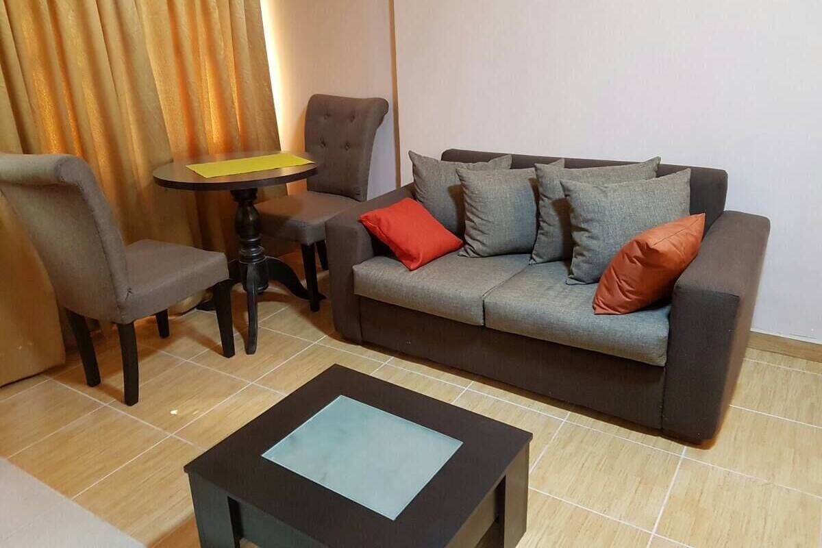 Deluxe Apartment, 1 Bedroom | Living area | 1-inch TV with cable channels