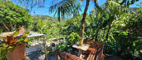 Business Studio, Garden View | Living area | Flat-screen TV