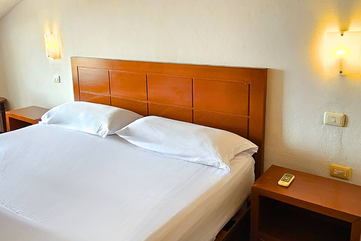 Quarto conforto, 1 cama King | Roupa de cama