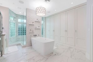 Bathtub, hair dryer, towels
