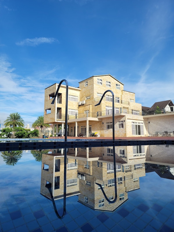 Seasonal outdoor pool, open 8:00 AM to 6:00 PM, pool umbrellas