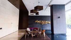 A modern interior with a pool, wooden flooring, and contemporary furniture. - Modern Studio with Stunning City Views (Kuala Lumpur)