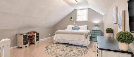 1 bedroom, desk, iron/ironing board, travel crib