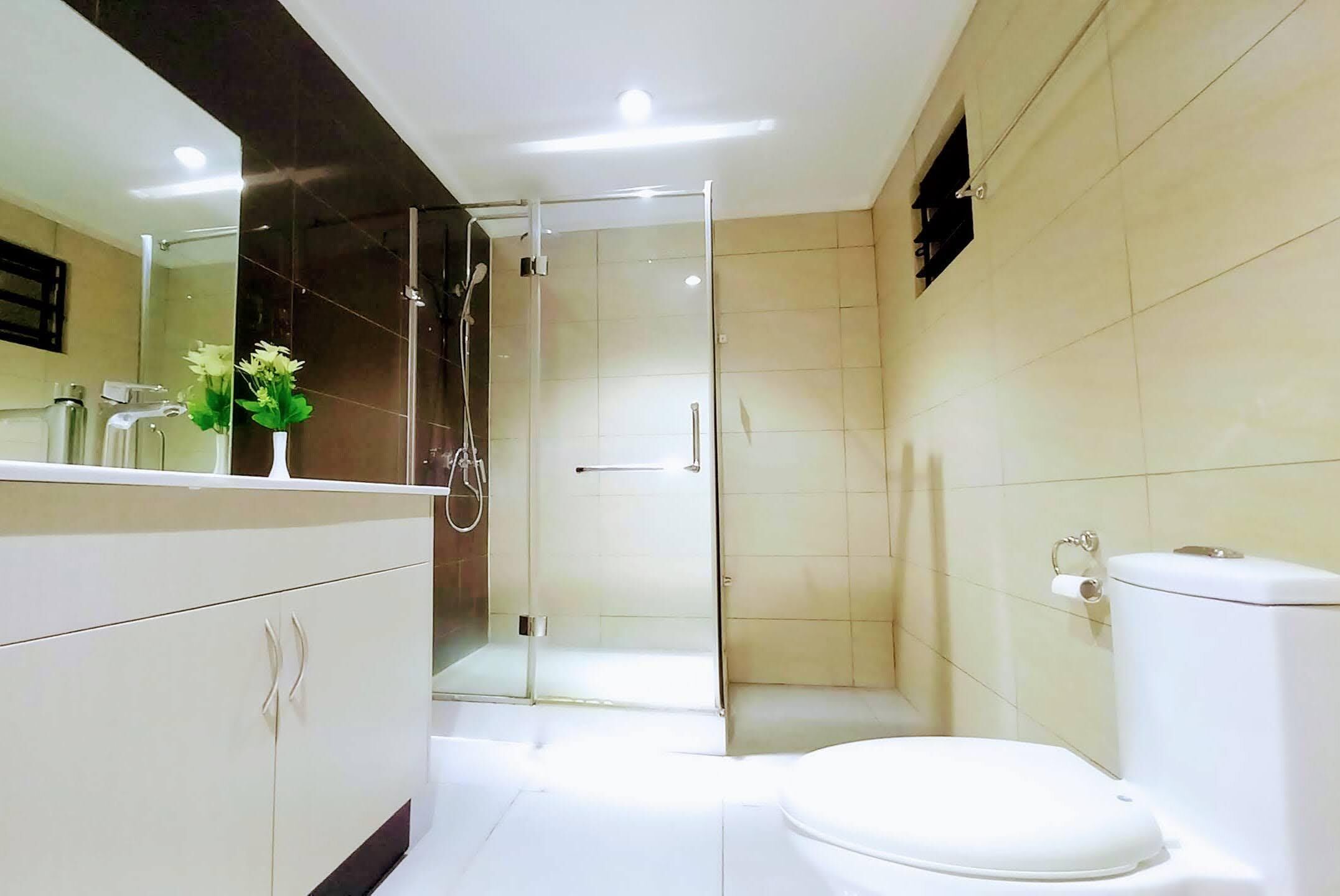 Shower, designer toiletries, hair dryer, slippers