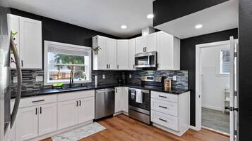 Coffee/tea maker, fridge, microwave, oven