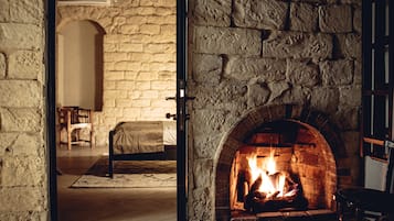 Deluxe Queen Room | Living area | 42-inch Smart TV with cable channels, Netflix, streaming services