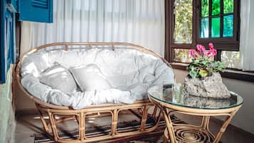 Deluxe Queen Room | Living area | 42-inch Smart TV with cable channels, Netflix, streaming services